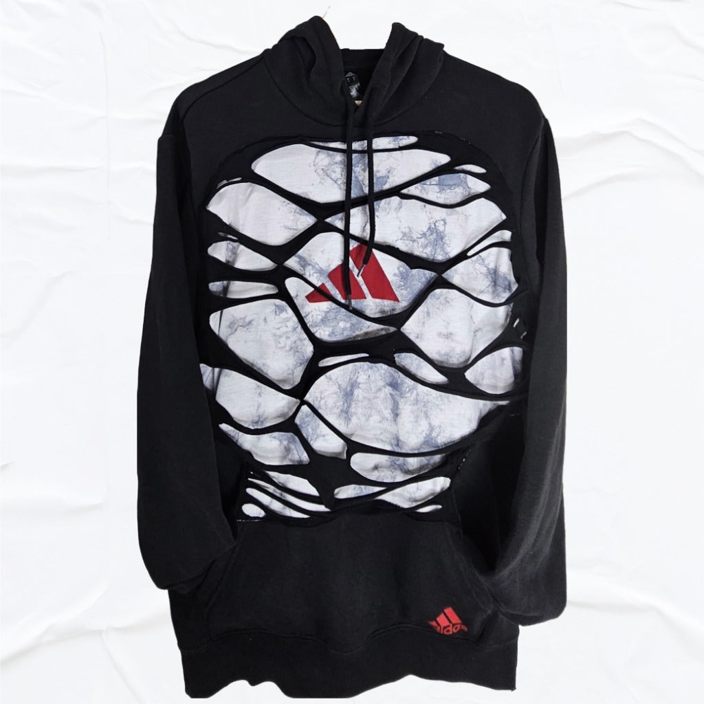 Black hoodie with a unique design and red logo on a white- marble background, upcycled by Vivifica