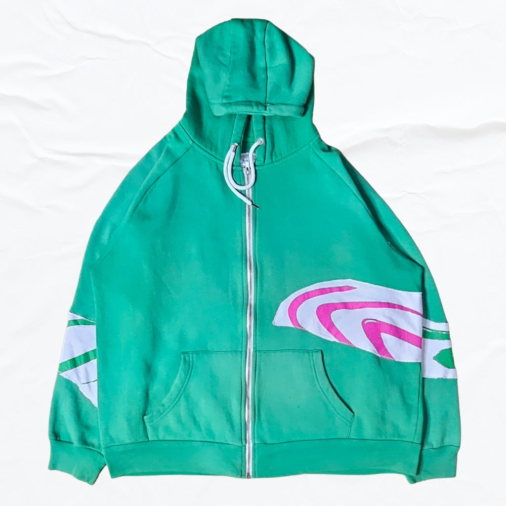 Green hoodie with a  patterns of pink, green, and white on sleeves and body