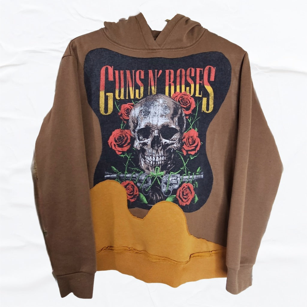 A one-of-one upcycled hoodie crafted from reclaimed fabrics. Featuring rich cocoa tones with a tan drip panel and a bold vintage-style graphic.