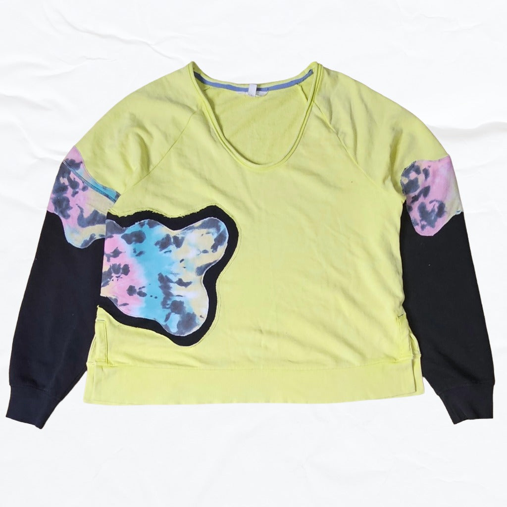 Yellow long-sleeve shirt with black and tie-dye patterns on sleeves and body
